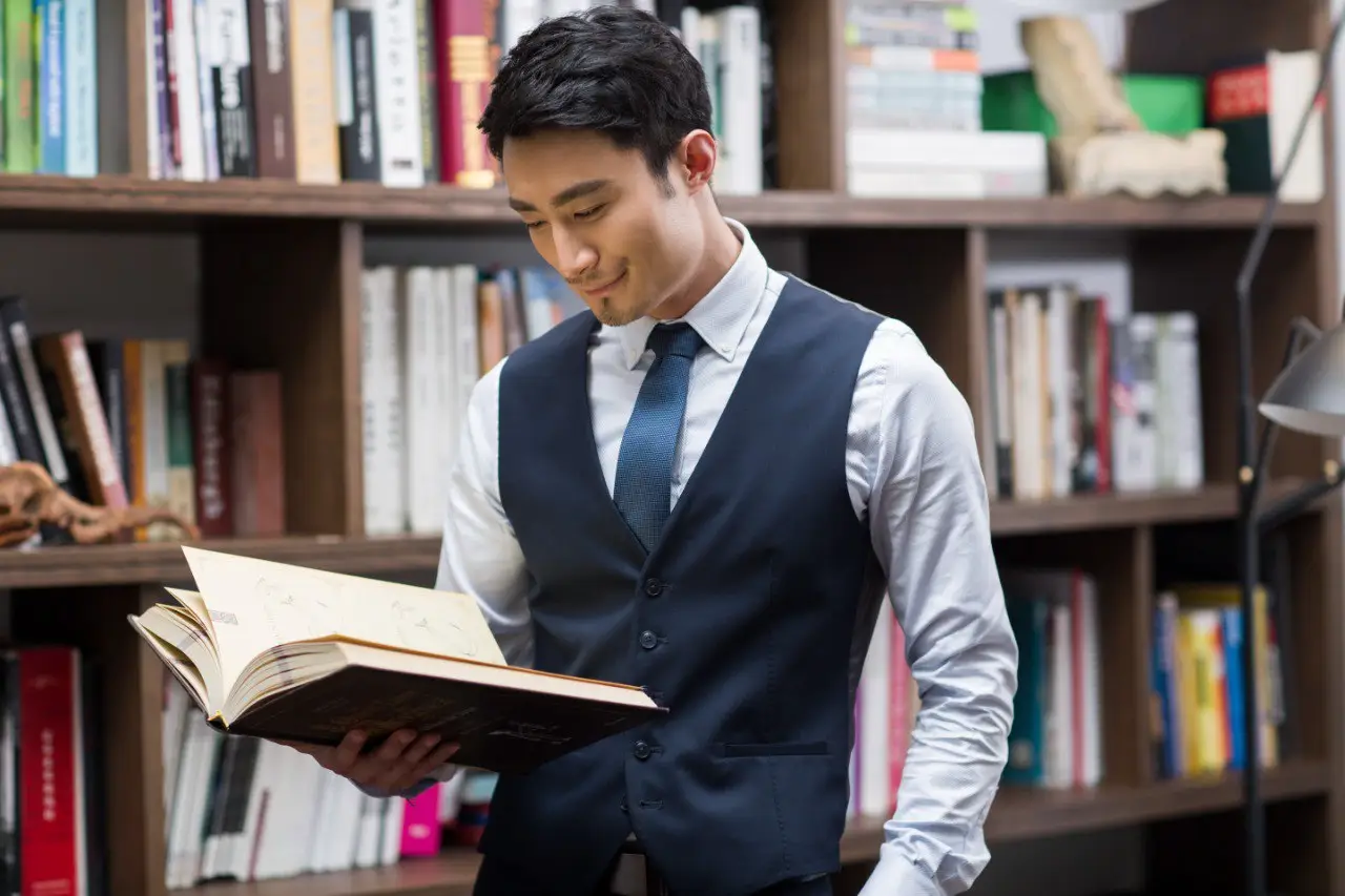 Wide landscape of a sunrise mountain ridge with a solitary walker in silhouette, 3:2 framing to communicate spaciousness and personal growth themes, crisp clarity and natural colors.