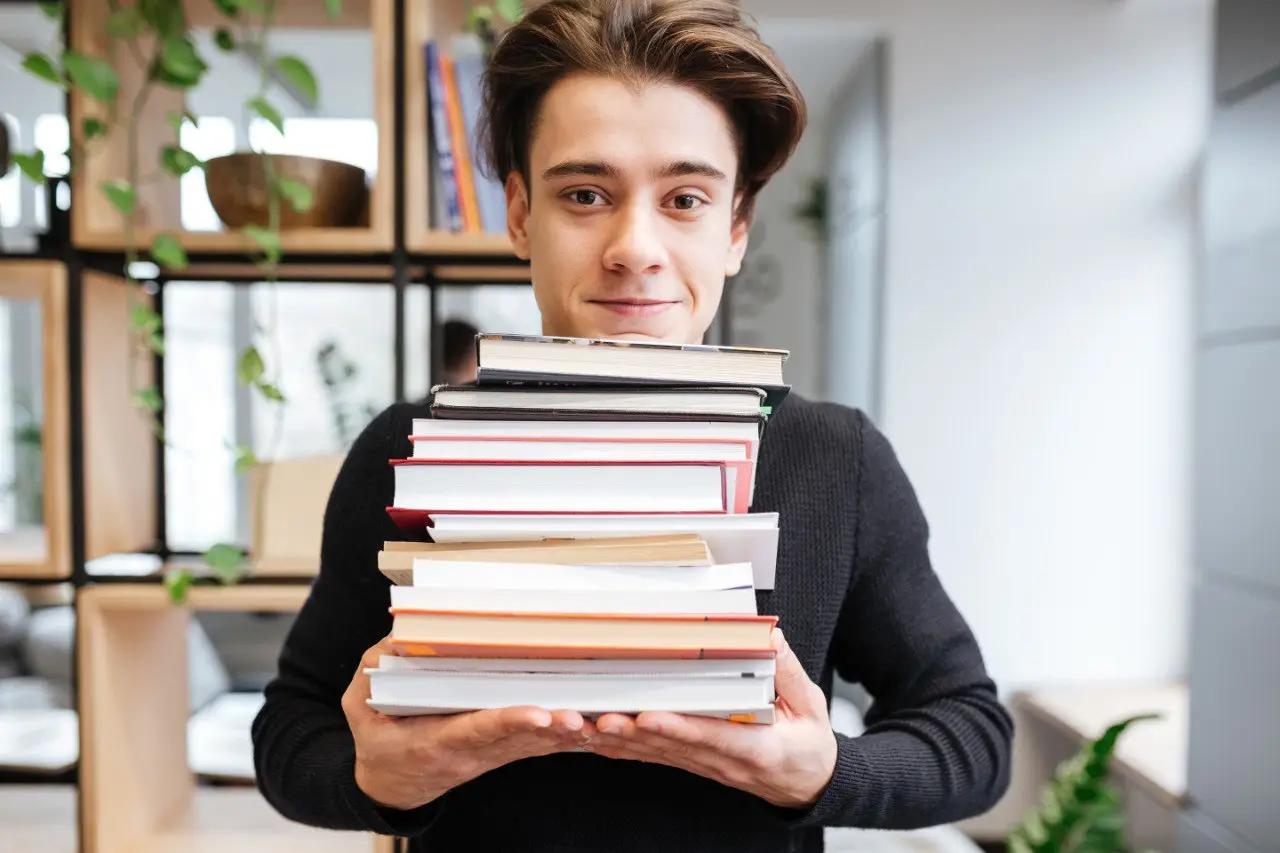 Wide landscape of a sunrise mountain ridge with a solitary walker in silhouette, 3:2 framing to communicate spaciousness and personal growth themes, crisp clarity and natural colors.