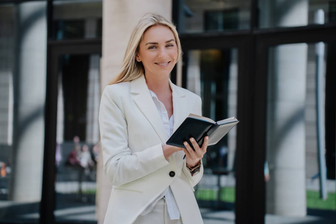 Wide landscape of a sunrise mountain ridge with a solitary walker in silhouette, 3:2 framing to communicate spaciousness and personal growth themes, crisp clarity and natural colors.
