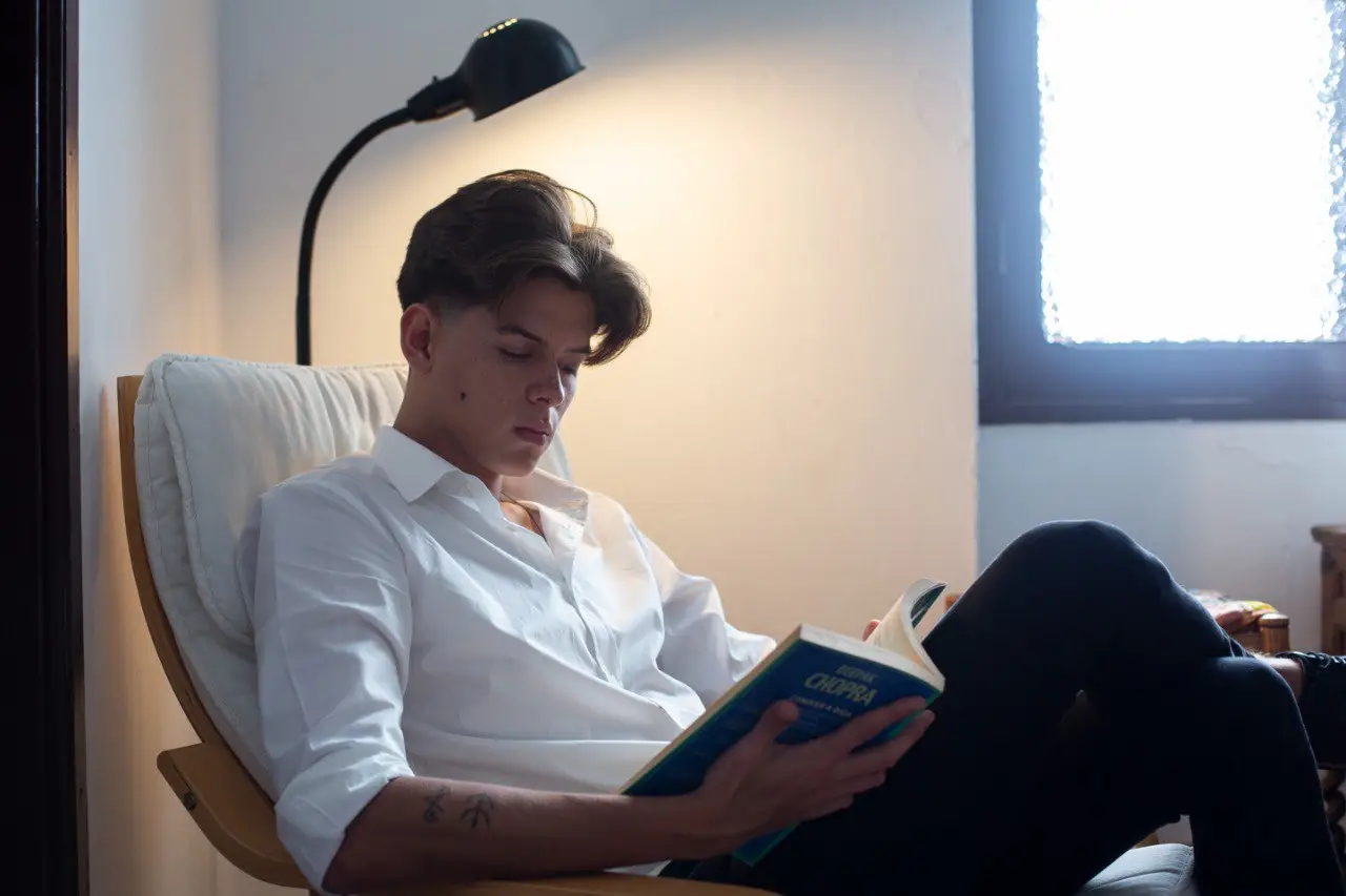 Wide landscape of a sunrise mountain ridge with a solitary walker in silhouette, 3:2 framing to communicate spaciousness and personal growth themes, crisp clarity and natural colors.