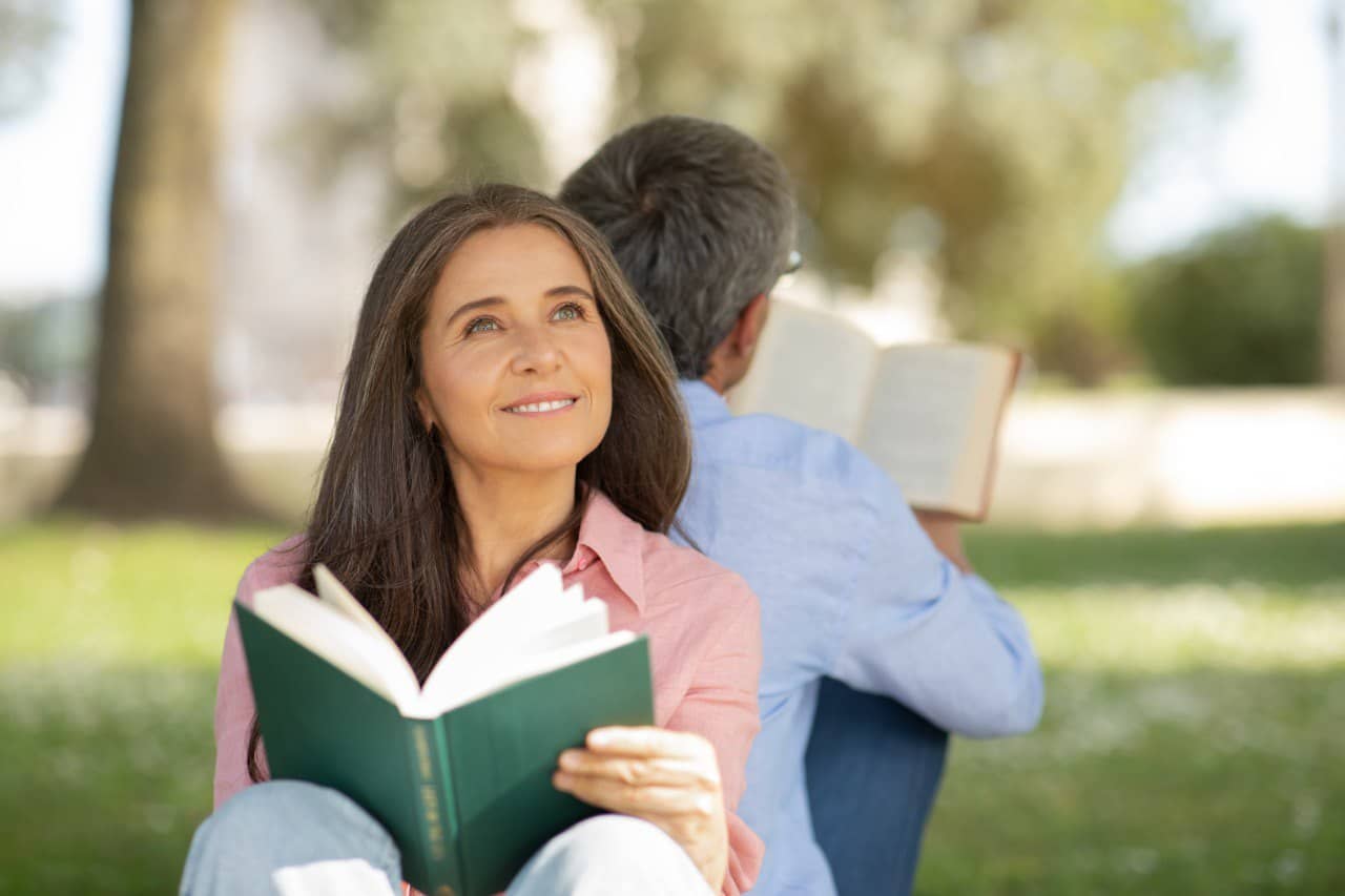 Wide landscape of a sunrise mountain ridge with a solitary walker in silhouette, 3:2 framing to communicate spaciousness and personal growth themes, crisp clarity and natural colors.