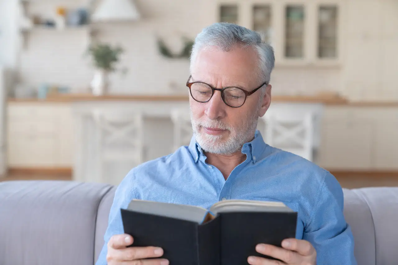 Wide landscape of a sunrise mountain ridge with a solitary walker in silhouette, 3:2 framing to communicate spaciousness and personal growth themes, crisp clarity and natural colors.