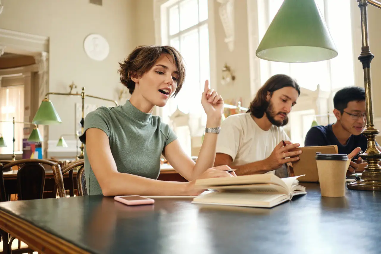 Wide landscape of a sunrise mountain ridge with a solitary walker in silhouette, 3:2 framing to communicate spaciousness and personal growth themes, crisp clarity and natural colors.