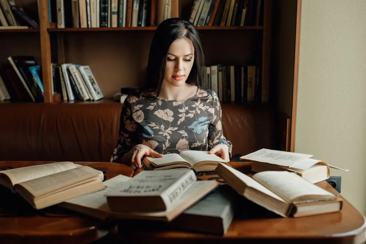 Wide landscape of a sunrise mountain ridge with a solitary walker in silhouette, 3:2 framing to communicate spaciousness and personal growth themes, crisp clarity and natural colors.