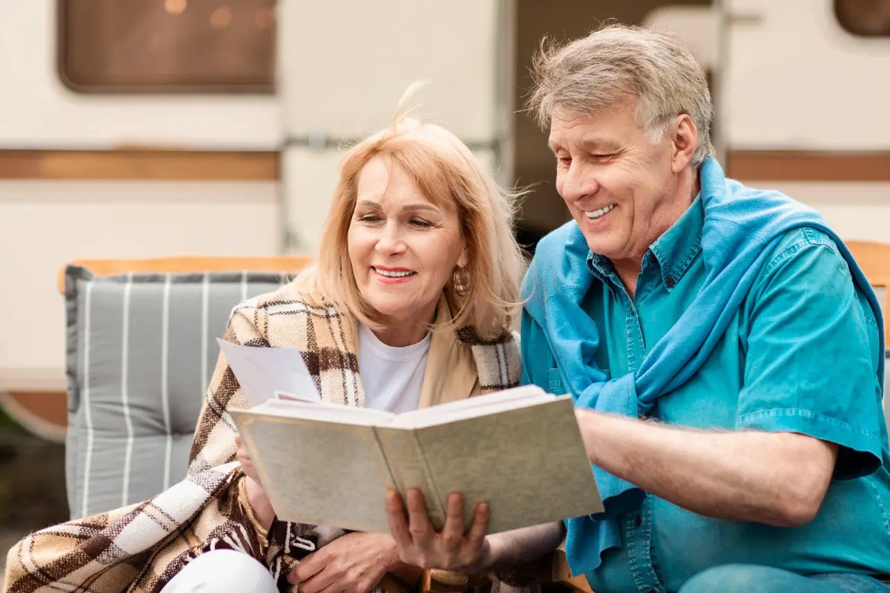 Wide landscape of a sunrise mountain ridge with a solitary walker in silhouette, 3:2 framing to communicate spaciousness and personal growth themes, crisp clarity and natural colors.