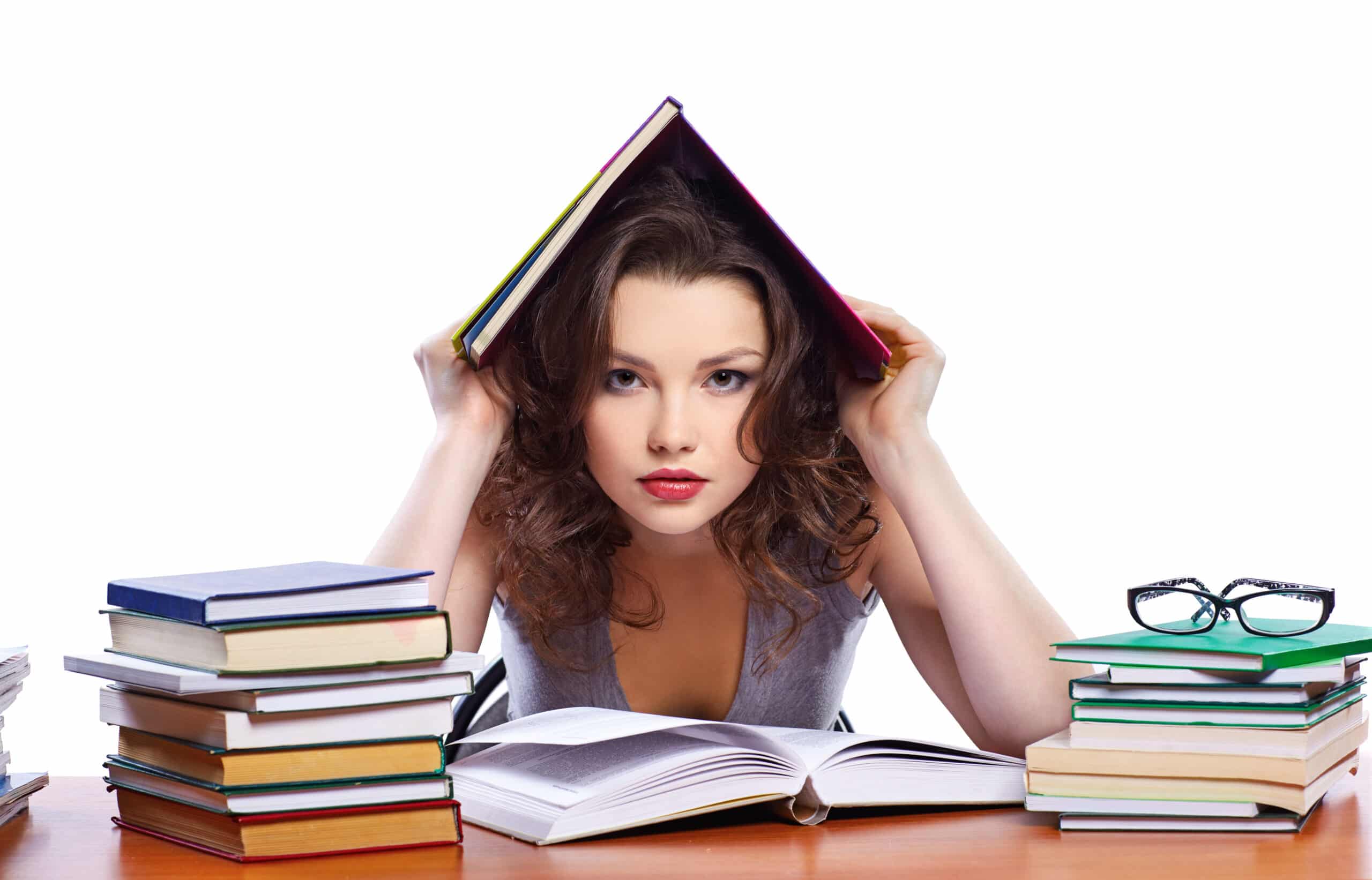 woman with books on head at table 2026 04 13 02 00 30 utc scaled